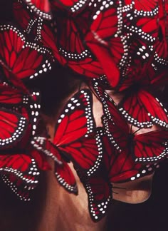 many red butterflies with white dots on them