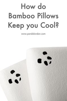 two white towels with black paw prints on them and the words how do bamboo pillows keep you cool?