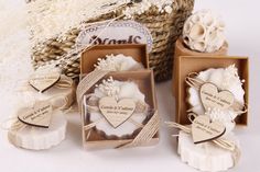 wedding favors and soaps are displayed in boxes