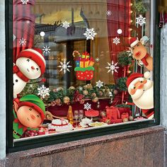 christmas decorations in the window of a store