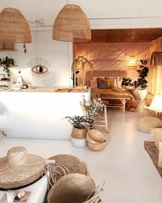 a living room filled with lots of wicker furniture