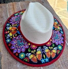 Embroidered Mexican hat  This beautiful embroidered Mexican hat is perfect to add that special touch to any outfit. This hat is structure with high crown an the wide brim had beautiful embroidered designs  VERY IMPORTANT ABOUT SHIPPING:  ALL ITEMS IN LTFMex ARE SHIPPING IN CORRUGATED BOX FOR PROTECT OUR PRODUCTS. Mexican Flower Hat, Mexican Clothing, Mexican Hat, Mexican Outfit, Embroidered Designs, Corrugated Box, Handmade Hat, Exeter, Embroidered Design