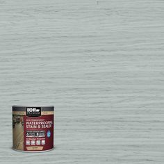 a can of brown wood flooring stain and sealer on a dark wooden surface