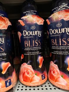 three bottles of dunkin'donuts bliss are on display in a grocery store