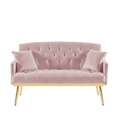 a pink velvet couch with gold legs and pillows on it, against a white background