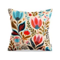 a pillow with colorful flowers and leaves on it