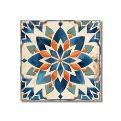 a blue and orange tile with an intricate design on the bottom, surrounded by small leaves