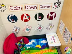 a bulletin board with pictures and magnets on it in front of a classroom door