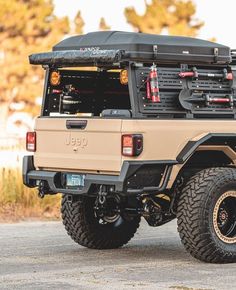 an off - road vehicle is parked on the street