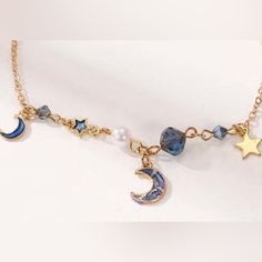 “Blue Marbled Crescent Moon” Stars Stellar Sky Celestial Cosmos Galaxy Universe Heavenly Astrology Astronomy Beaded Gold Chain Bracelet/Anklet. Lovely Cosmos Themed Bracelet Or Anklet With Unique Looking Blue Textured/Marbled Central Crescent Moon, Gold & Blue Enamel Stars, Smaller Blue Enamel Crescent Moon, White Pearl Bead, & Faceted Blue/Gray Beads On A Gold Link Chain. New. Measurements: Length: 7” (+ 2” Extender Chain) If You Want It, Don’t Let It Get Away Send Me An Offer! I Love To Do Bun Arcane Oc, Galaxy Bracelet, Cosmos Galaxy, Wwjd Bracelet, Large Cuff Bracelet, Galaxy Universe, Moon Gold, Gold Chain Bracelet, Bow Bracelet