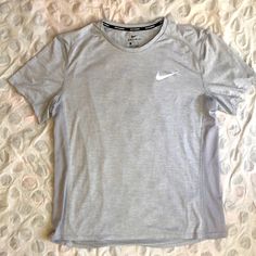 Nike Running Dri-Fit Athletic Shirt Size Xl Silver-Grey Color Sweat-Wicking And Lightweight Pristine Condition, Washed Once But Never Worn Nike Gray Crew Neck Shirt, Nike Gray Cotton Tops, Nike Gray Short Sleeve Shirt, Nike Athletic Fit Sports T-shirt, Nike Crew Neck T-shirt For Running, Fitted Silver T-shirt With Short Sleeves, Nike Gray Sports T-shirt, New York Yankees Shirt, Shirts Nike