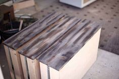 a table made out of wood sitting on top of a floor