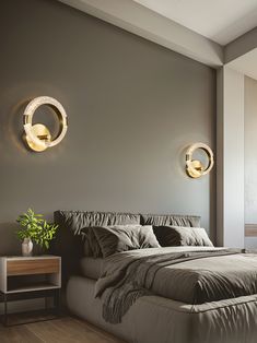 a large bed sitting under two round lights