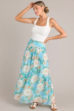 This flowy, light blue maxi skirt is the ultimate must-have for your wardrobe! The MINKPINK Evelyn skirt will keep you effortlessly stylish and comfortable all day long. Its breezy design makes it ideal for any occasion, while the light blue color adds a touch of playfulness to your outfit. This light blue maxi features a panelled waist, back zipper entry, a floral print, and a high waisted design. 80% Viscose, 20% Polyamide Hand Wash Cold﻿ Lined, 100% Viscose Manufactured in China Designed in A Light Blue Lined Maxi Skirt For Summer, Spring Light Blue Relaxed Maxi Skirt, Light Blue Long Skirt For Beach, Casual Light Blue Long Maxi Skirt, Light Blue Maxi Skirt, Blue Full-length Maxi Skirt For Spring, Blue Maxi Skirt, China Design, Blue Maxi