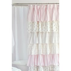 a shower curtain with pink and white ruffles