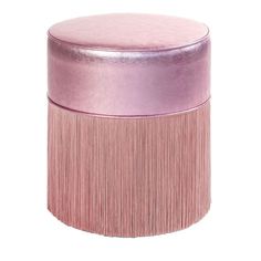 a pink stool with fringe trim on the top and bottom, in front of a white background