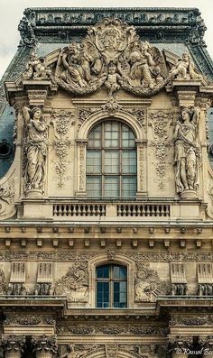 an ornate building with statues on it