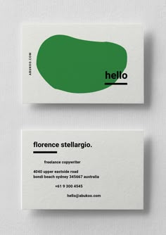 two business cards designed to look like the logo for a shoe company, with green and black