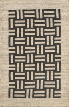 an area rug with black and white designs on it