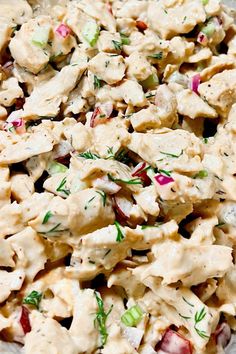 a bowl filled with chicken salad on top of a table