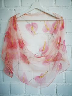 Hand painted Silk Chiffon scarf- Flamingo flower Hearts. Anthurium (sometimes very beautifully called Flamingo flowers) is a symbol of hospitality and it's flower shape reminds the heart- so can be great accessory for a wedding! Light coral pink and Gold with some reds will make your day full of love. This design Scarf is MADE TO ORDER and available in 2 SQUARE and 5 OBLONG sizes: 21*x21 inches (55x55cm)- Very small square. Can serve as a kerchief; wrist, head or bag band. 35*35 inches (90*90cm) Summer Pink Floral Print Dupatta, Pink Floral Print Shawl Scarf, Elegant Pink Floral Print Dupatta, Pink Floral Print Scarf As Gift, Pink Floral Print Scarves As Gift, Pink Floral Print Scarf For Gift, Pink Silk Shawl Scarf For Wedding, Pink Silk Shawl For Wedding, Pink Silk Wedding Shawl