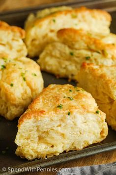 some biscuits are sitting on a baking sheet