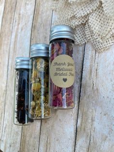 three jars filled with different types of spices