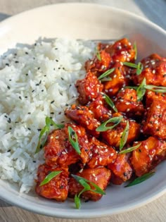 a white plate topped with chicken and rice