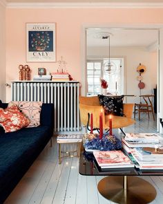 a living room filled with furniture and a radiator