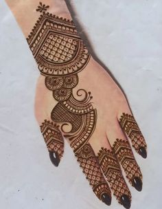 a henna design on the palm of someone's hand