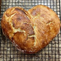 two loaves of bread sitting on top of a cooling rack