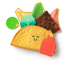 a taco and some other food items on a white surface with a smiling face