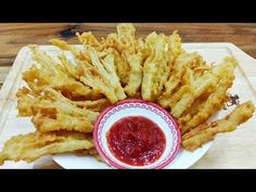 some fried food on a plate with ketchup