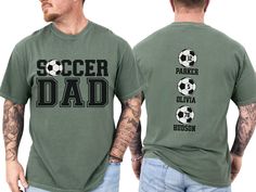 Celebrate your favorite soccer player with our custom soccer dad shirt, personalized with the players names on back. With short sleeves and a classic crewneck, this shirt makes the perfect gift for the soccer father who loves to show his support on game day at the soccer fields, making him feel like a varsity soccer super fan. COMFORT COLORS 1717 SHIRT: Unisex 100% US cotton - ethically grown and harvested Pre-Shrunk Fabric Relaxed Fit - Size up for a trendy oversized look Seamless Sides Double Personalized Sporty T-shirt For Sports, Sporty Personalized T-shirt For Sports Events, Sporty Personalized T-shirt For Sports, Personalized Crew Neck T-shirt For Game Day, Personalized Crew Neck Sports Top, Soccer Dad Shirt, Soccer Boyfriend, Dad Tshirt, Dad Shirts