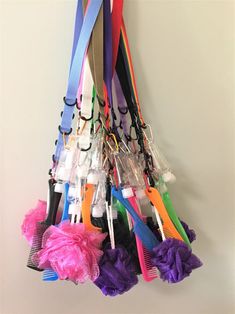 a bunch of colorful hair clips hanging on a wall