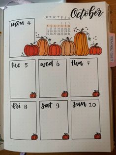 an open planner with pumpkins on it and the date for each month is shown