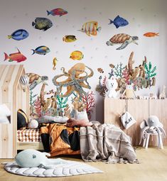 a child's room decorated with under the sea wall decals and stuffed animals