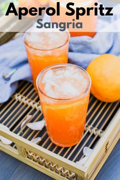 two glasses of aperoli spritz sangria on a tray