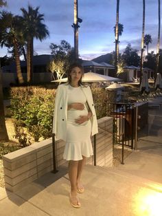 Introducing the Claire - a simple yet stylish and complementing dress to be worn throughout all stages of pregnancy. It’s figure-flattering and perfect for a warmer weather occasion or night out. We love the sassy fit and flare style that falls slightly below the knees. As worn on air by Megan Telles, news anchor for KTLA-5 (last 3 photos)! Color: White/Off-White Below knee length Body-con fit with flare bottom Fabric: 100% Stretch Milk Fiber Care: Gentle wash cold with like colors / do not blea Elegant Spring Bump Friendly Dresses, Elegant Bump Friendly Spring Dresses, Elegant Spring Dresses, Bump Friendly, Elegant Spring Dresses Bump Friendly, Elegant Spring Maternity Dress Bump Friendly, Spring Maternity Dress, Nursing-friendly, Spring Maternity Dress Nursing Friendly, Chic Spring Bump-friendly Dress, Chic Maternity Dress For Fall