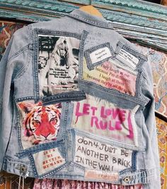 a denim jacket with pictures and words on it