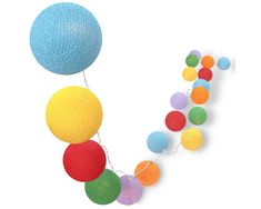 a string of multicolored balls is hanging from the ceiling on a white background