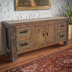 The Colorado Carved Buffet is a distressed-colored buffet that features intricate carvings, making it a stylish addition to any room. Its spacious tabletop and shelves provide ample storage space for household items.Wood78"L x 20"W x 35"HSimply wipe down your furniture with a dampened cloth. Then wipe away any remaining moisture with a dry clothDistressed colorThis item can be customized. Contact us at specialorders@lonestarwesterndecor.com or 1-877-493-3779 to inquire about custom sizes, design Interior Cabin Ideas, Home Designs Interiors, Distress Wood, Rustic Buffet, Interior Cabin, Studio Display, Heart Home Decor, Bohemian Living Room Decor, The Blacksmith