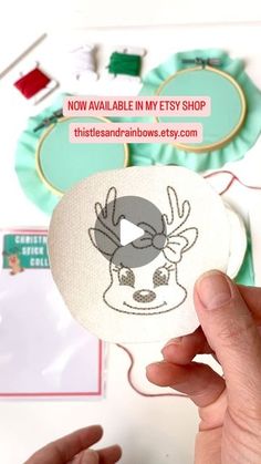 someone is holding up a button with an image of a deer on it and the words now available in my etsy shop