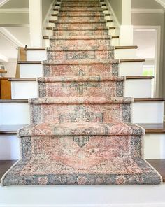 an old carpeted stair case in a house