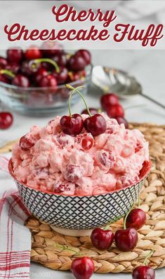 cherry cheesecake fluff in a bowl with cherries around it and the text overlay reads, cherry cheesecake fluff