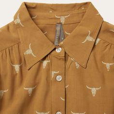 Fit for any cowgirl, this longsleeve poet blouse wears its Western influence proudly with an exclusive all-over Mojave steer head print. Crafted of high-quality 100% flat rayon, it has a light, airy texture and a flattering fit that allows for freedom of movement. It features gathers at the drop front shoulders and straight back yoke, two button cuffs, a button front placket and a full hem. Gathers At Drop Front Shoulders And Straight Back Yoke Long Sleeves with 2-Button Cuffs Collar and Button Steer Head, Poet Blouse, Printed Flats, Casual Bottoms, Denim Boots, Straight Back, Denim Outerwear, Outdoor Men, Women Shirts Blouse