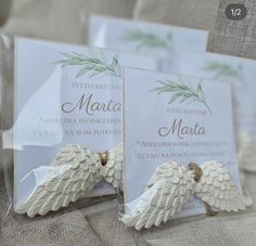 two wedding cards with angel wings on them