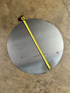 a metal plate with a measuring tape on it