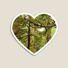 a heart shaped sticker with trees in the background