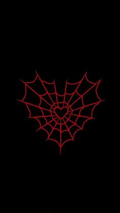 a red spider web on a black background